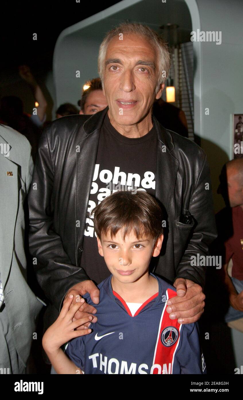 French actor Gerard Darmon and his son pictured at the party for the presentation of the PSG soccer team's new shirt made by sponsor Nike at the Parc des Princes stadium in Paris-France on June 29, 2004. Photo by Bruno Klein/ABACA. Stock Photo