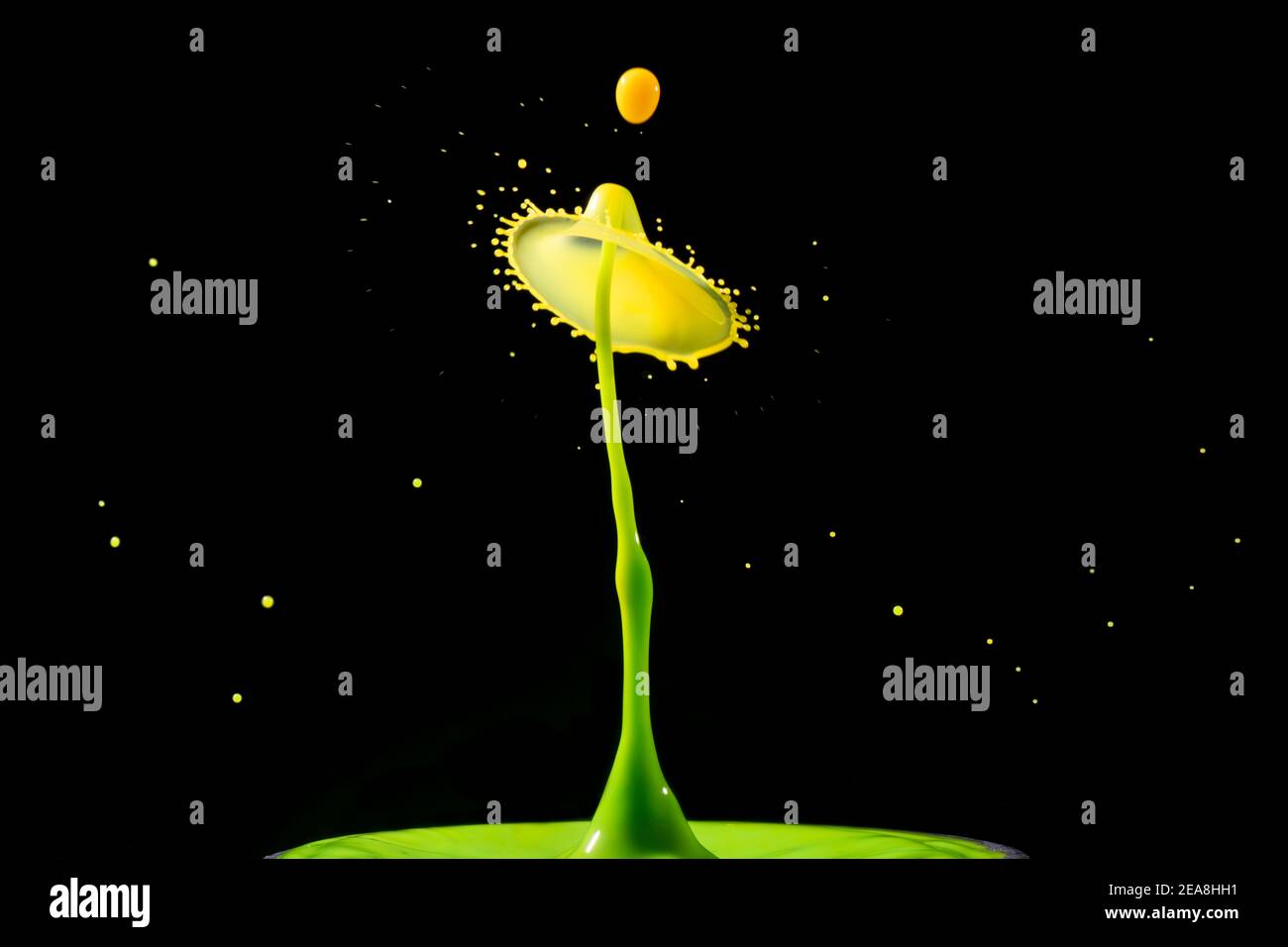 Green and yellow milk drop collision photography Stock Photo