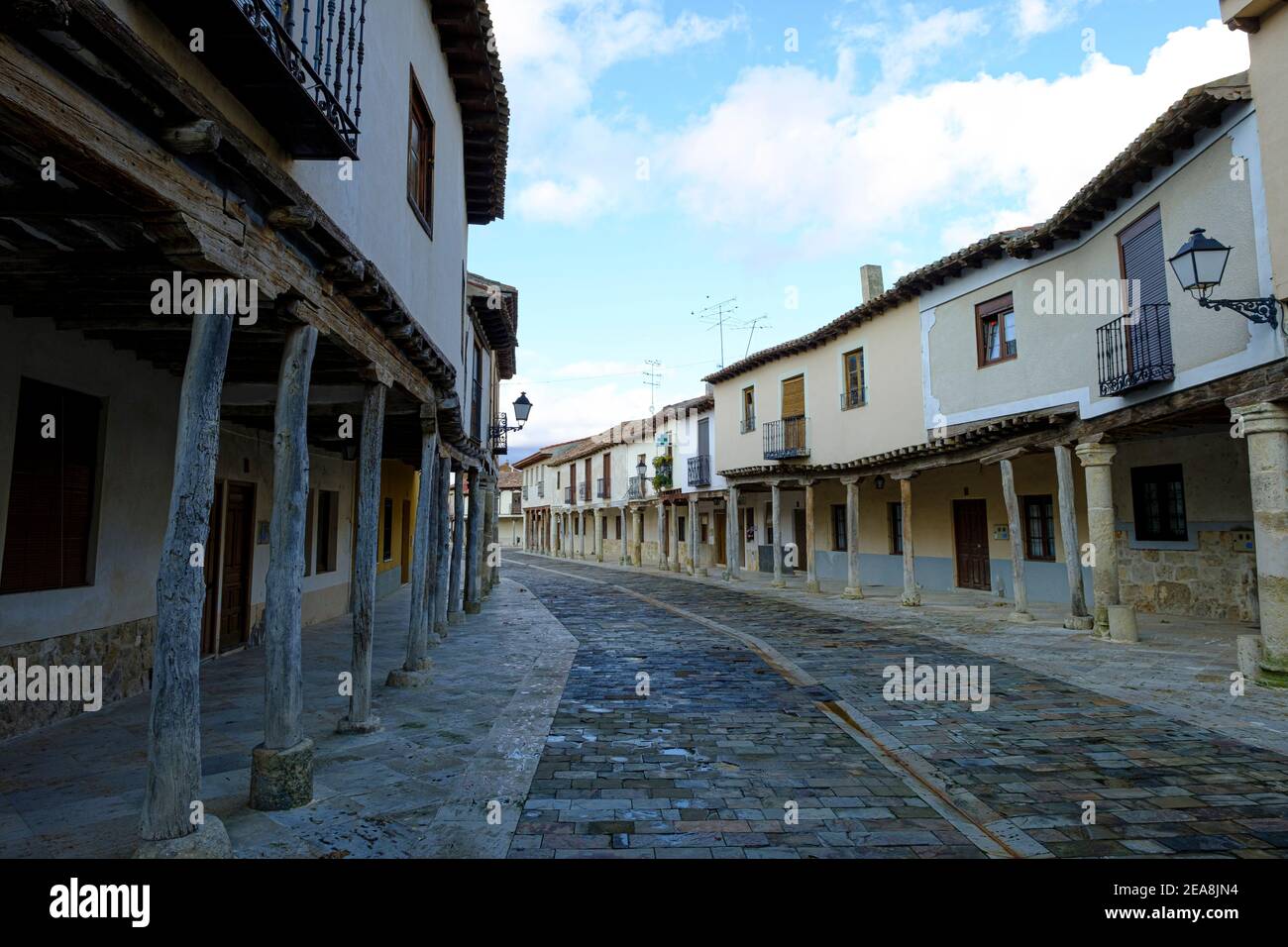 The historic adobe, arcaded streets of the old quarter. Ampudia, Palencia Province, Castille y Leon, Spain Stock Photo