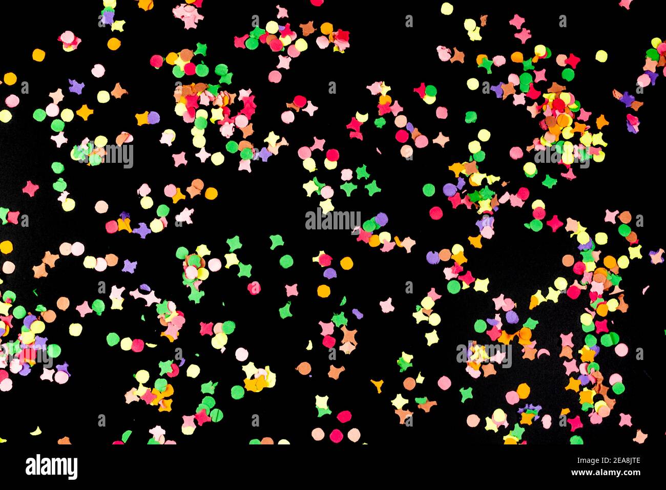 directly above view of colorful paper confetti isolated on black background Stock Photo