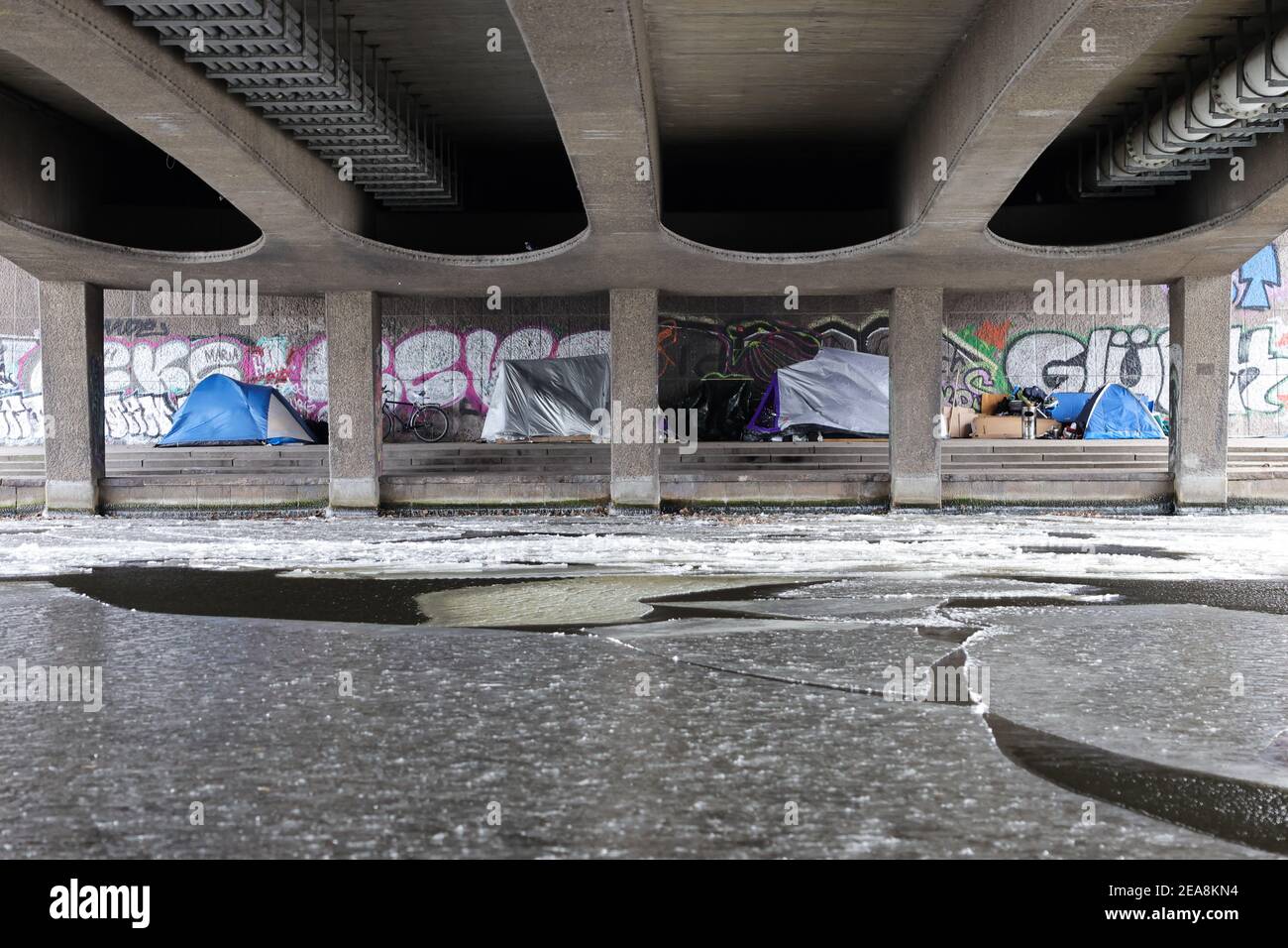 Hamburg, Germany. 08th Feb, 2021. Homeless people have pitched their tents under the Kennedy Bridge on the Alster. Despite the cold, homeless people in Hamburg still spend the night outdoors. Credit: Christian Charisius/dpa/Alamy Live News Stock Photo