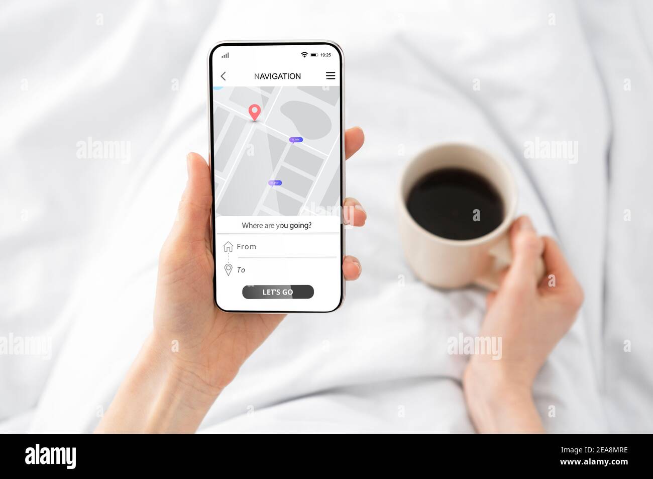 Woman Using Cellphone With Navigation App Browsing Route In Bedroom Stock Photo
