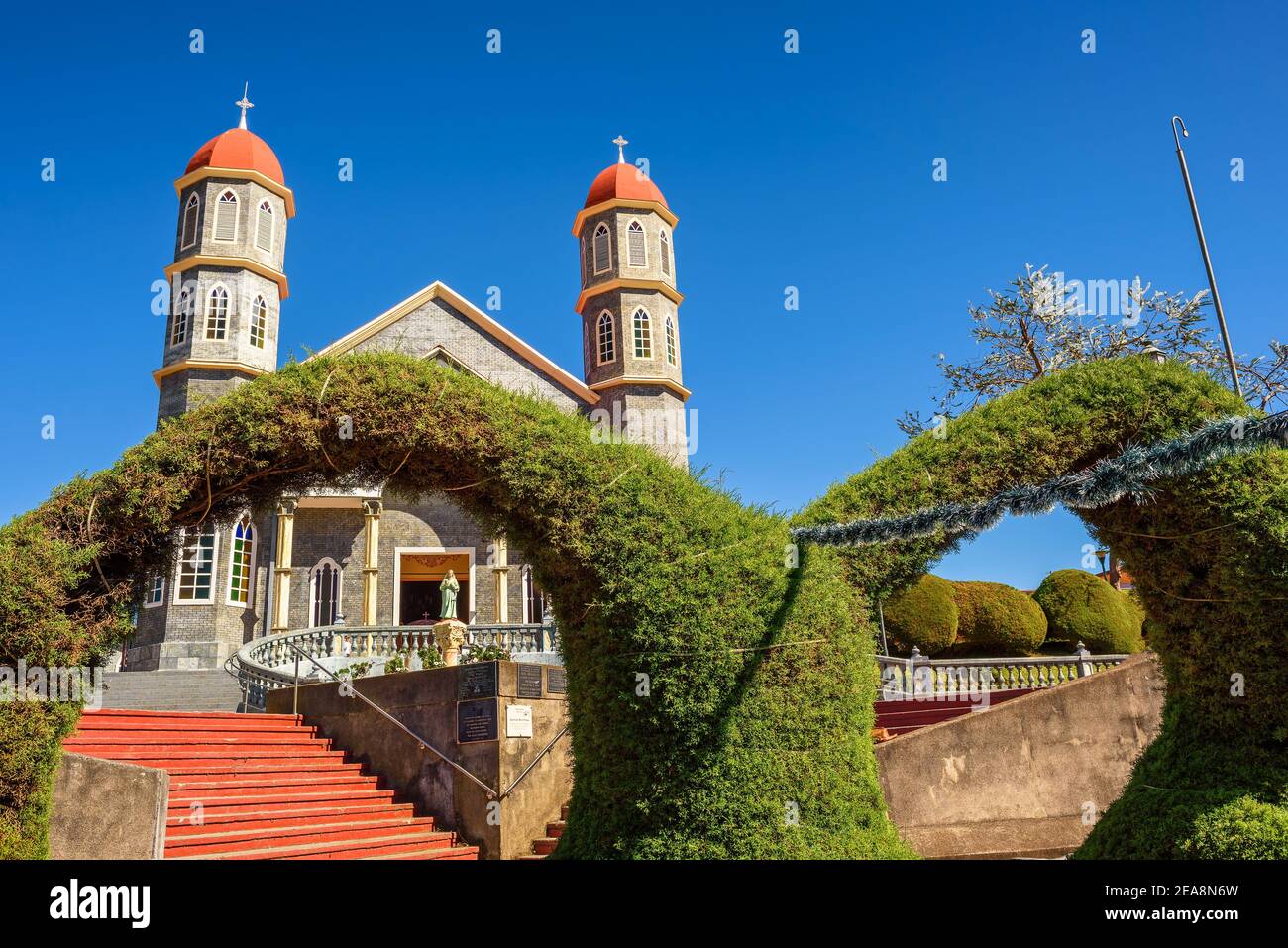 Catholic church with a park in Zarcero, Costa Rica Stock Photo