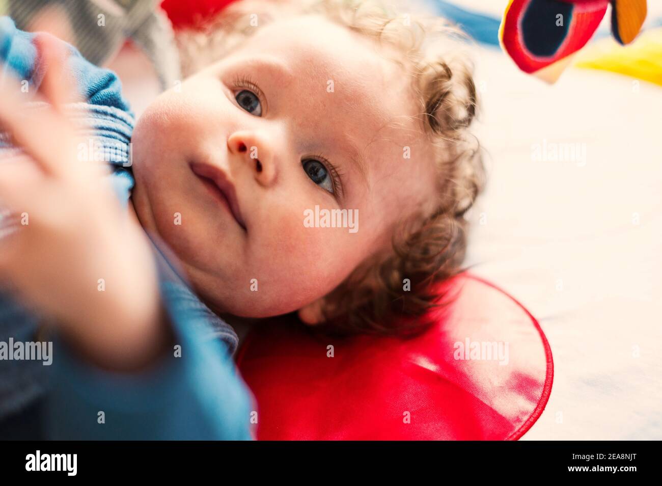 Baby boy exploring mobile toys Stock Photo