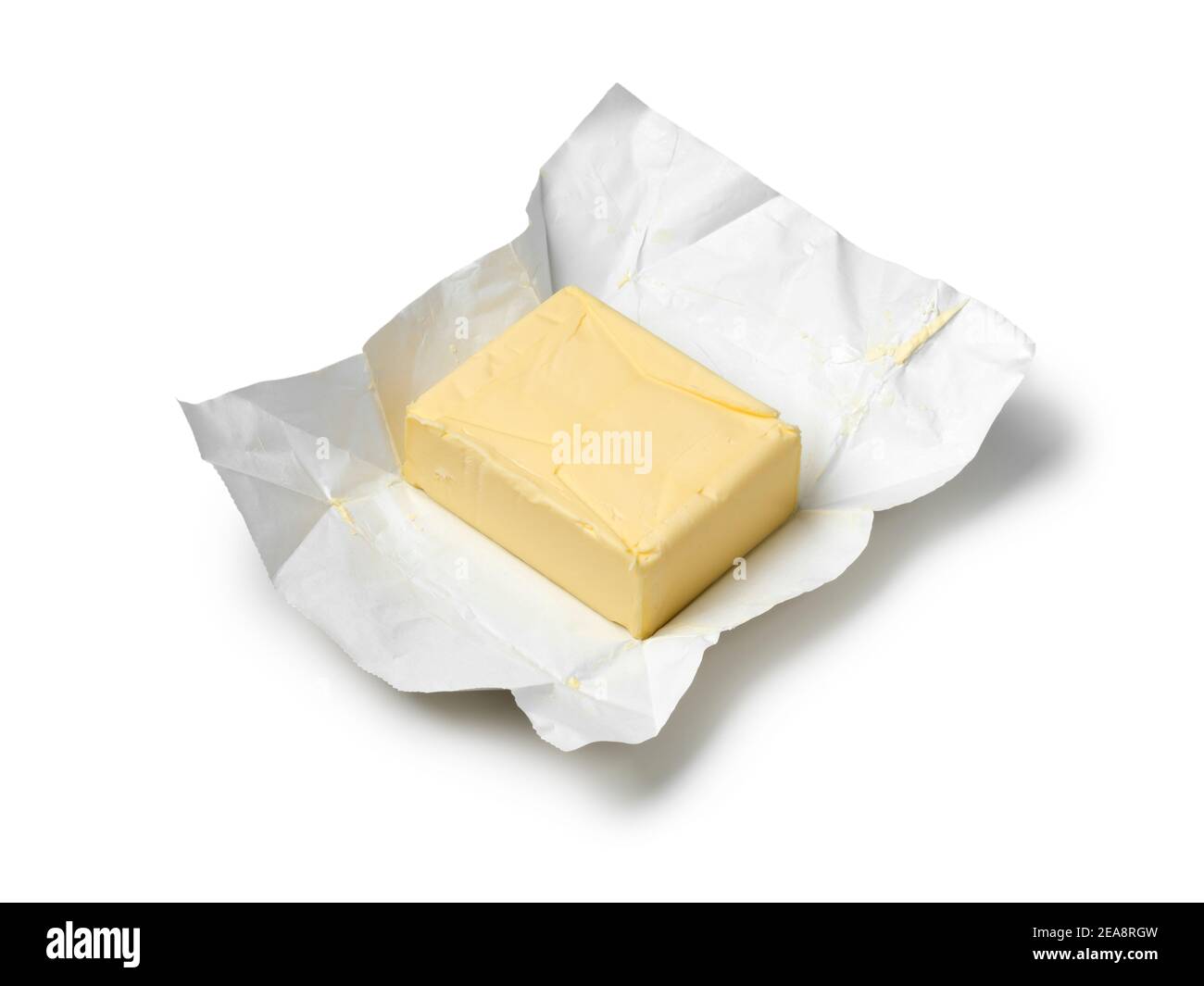 Traditional butter block unwrapped for use as a baking ingredient isolated on white background Stock Photo