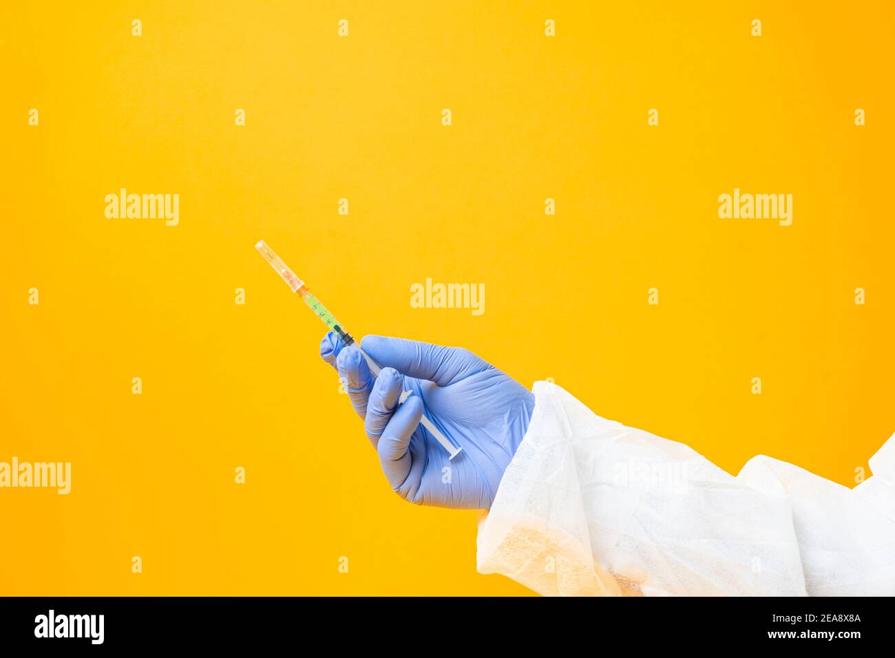 Syringe in a hand of the doctor or nurse. Hands in medical gloves. Hospital treatment. Cosmetic surgery Stock Photo
