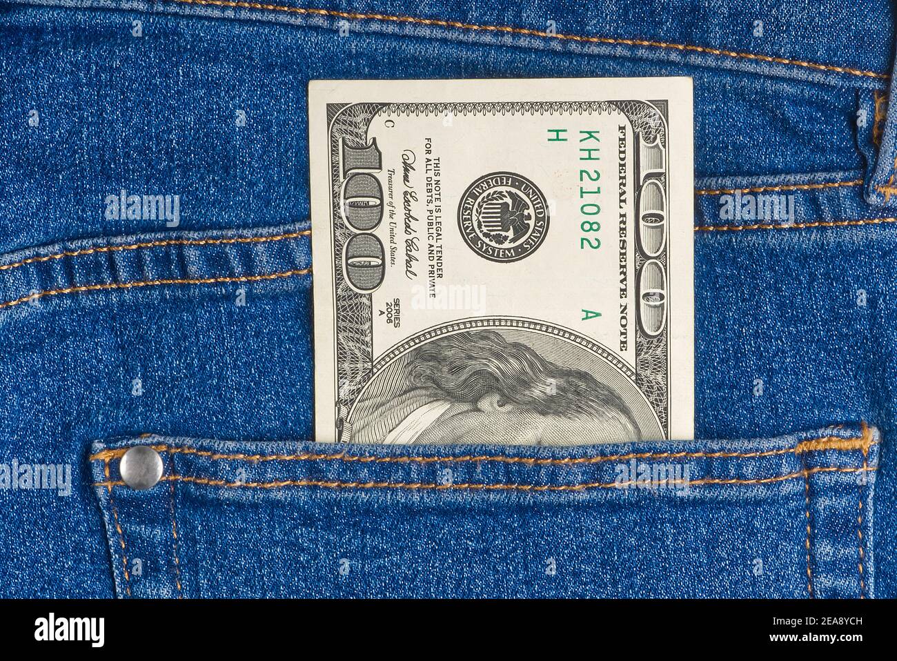 one hundred dollar note in the back pocket of blue jeans. dollar bills in  jeans pocket Stock Photo - Alamy