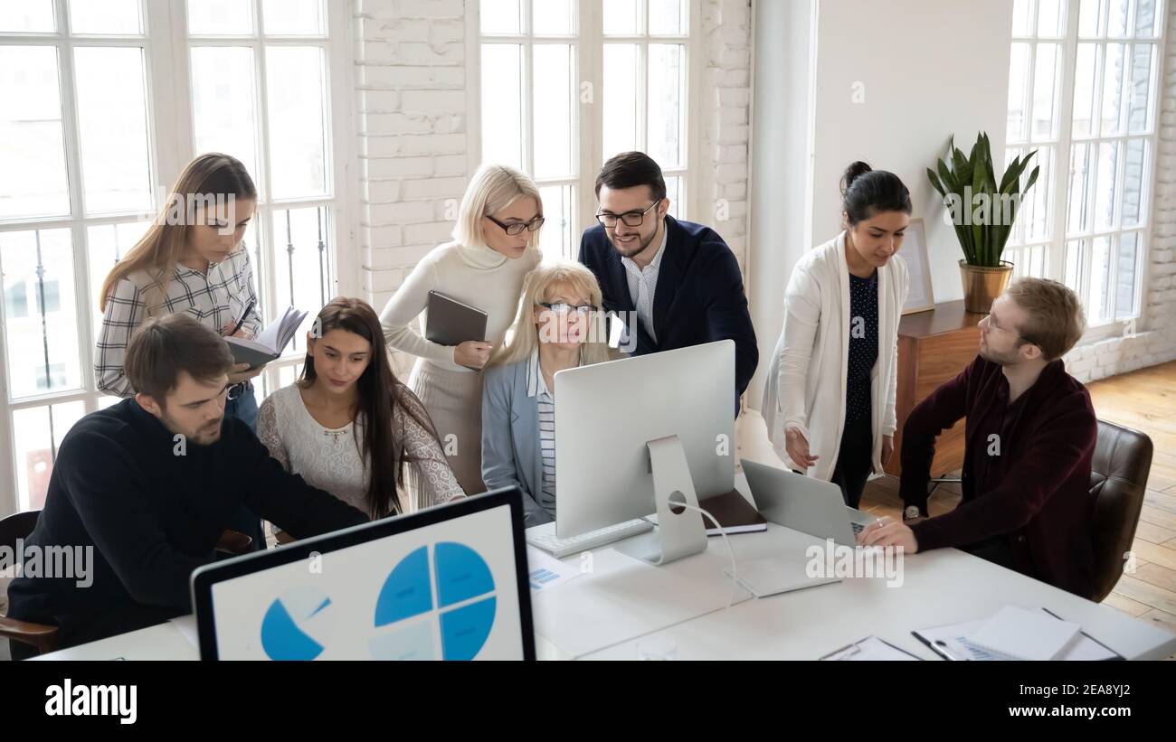 Marketing department team analyzing project reports Stock Photo