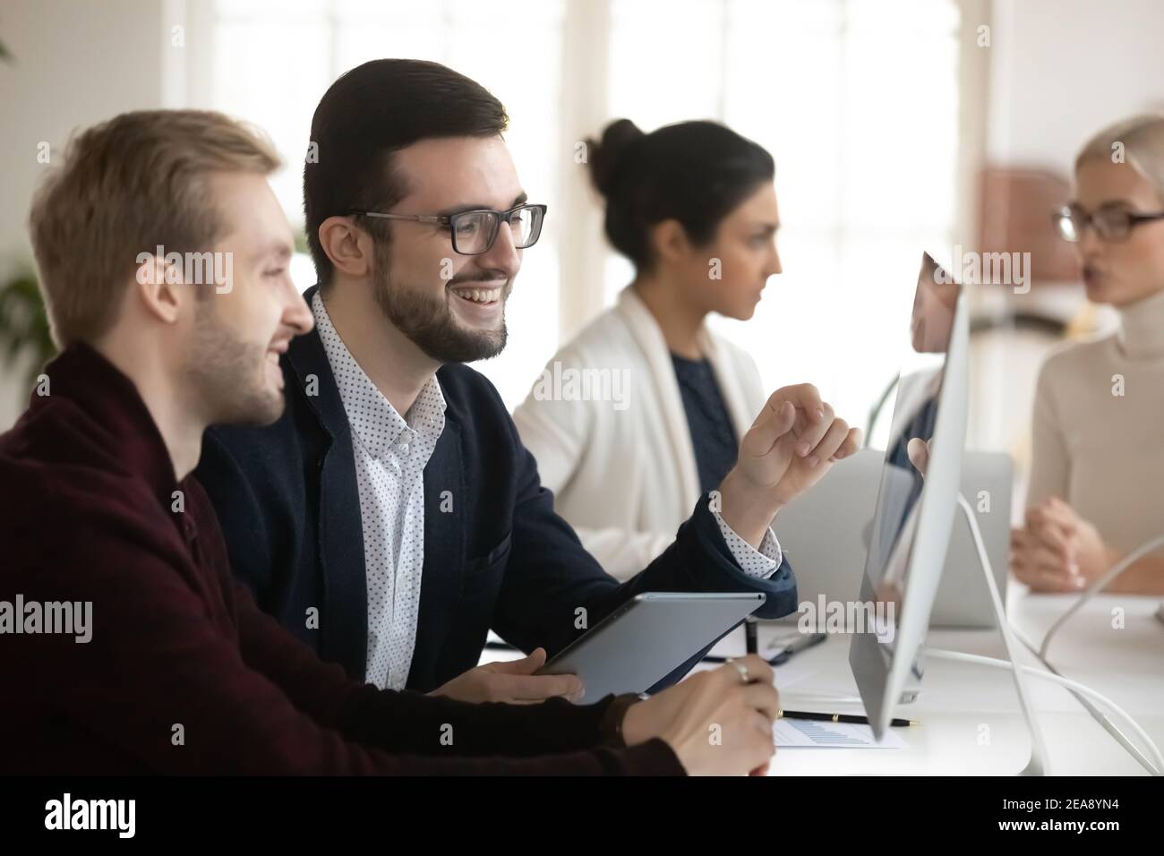 Happy male business leaders having video call or interview Stock Photo