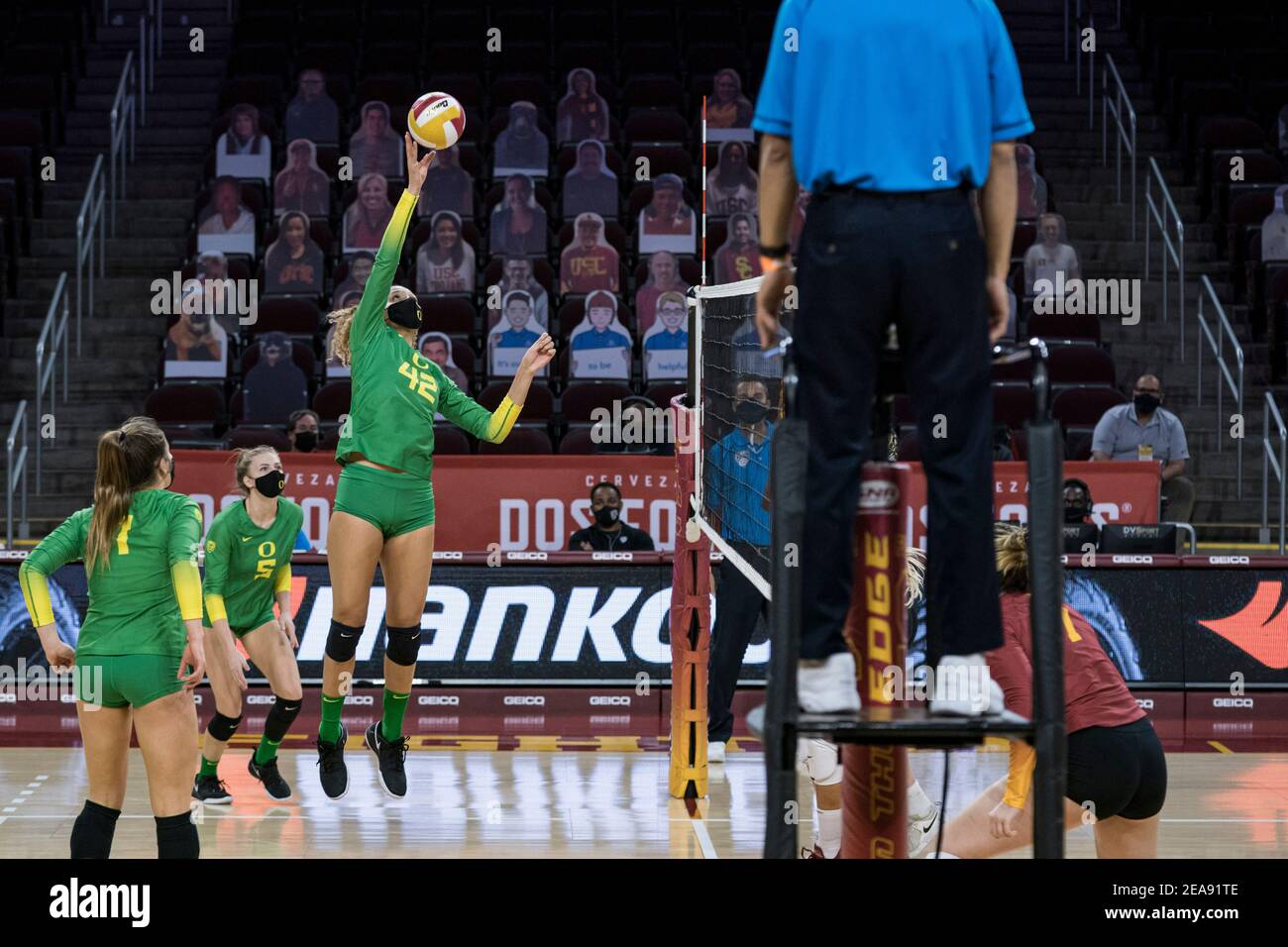 Oregon Ducks middle blocker Karson Bacon (42) goes for a dink during an NCAA women’s volleyball match against the Southern California Trojans, Sunday, Stock Photo