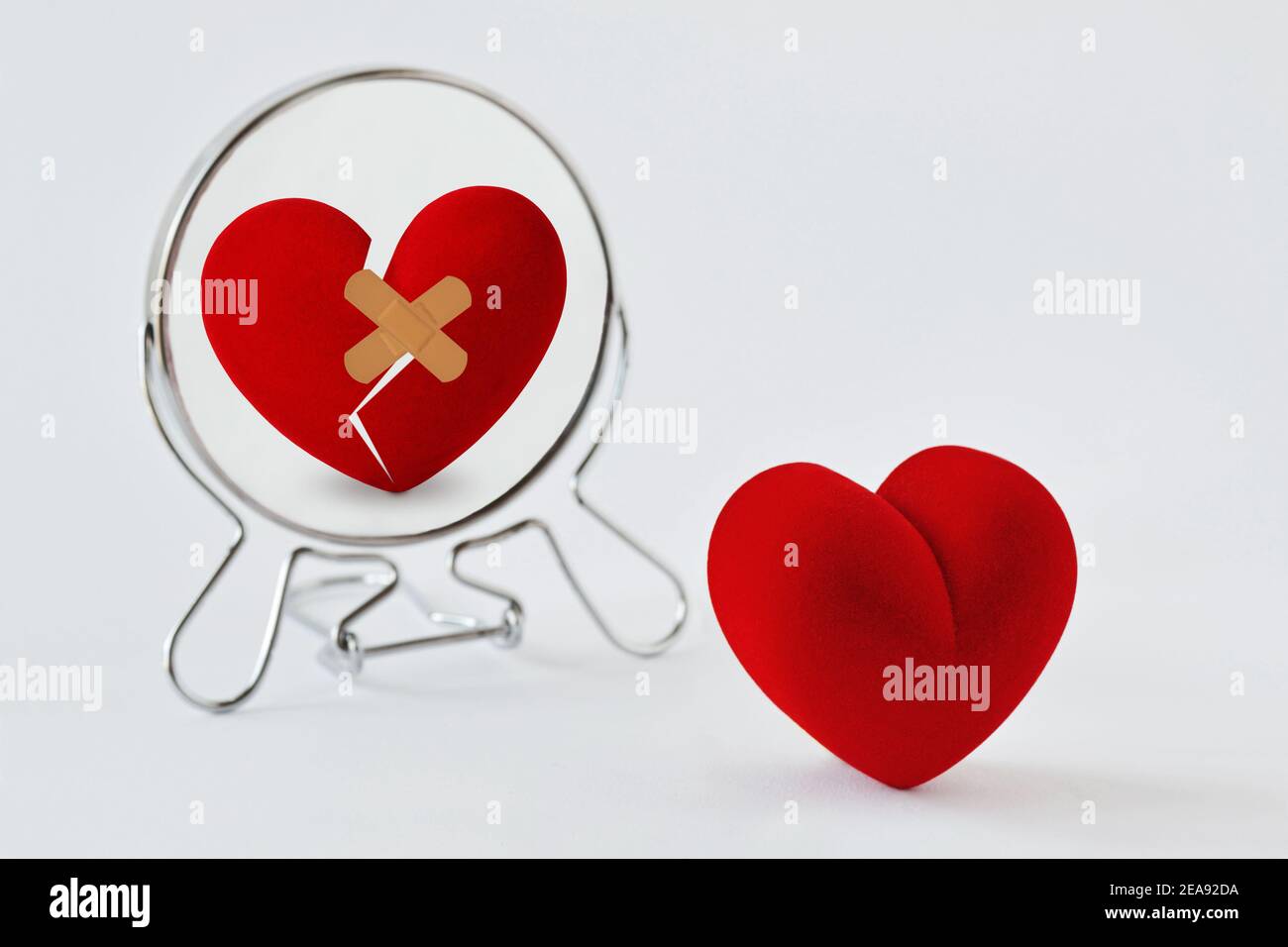 Broken heart looking in the mirror - Concept of love and pain Stock Photo -  Alamy, image size:1300x956