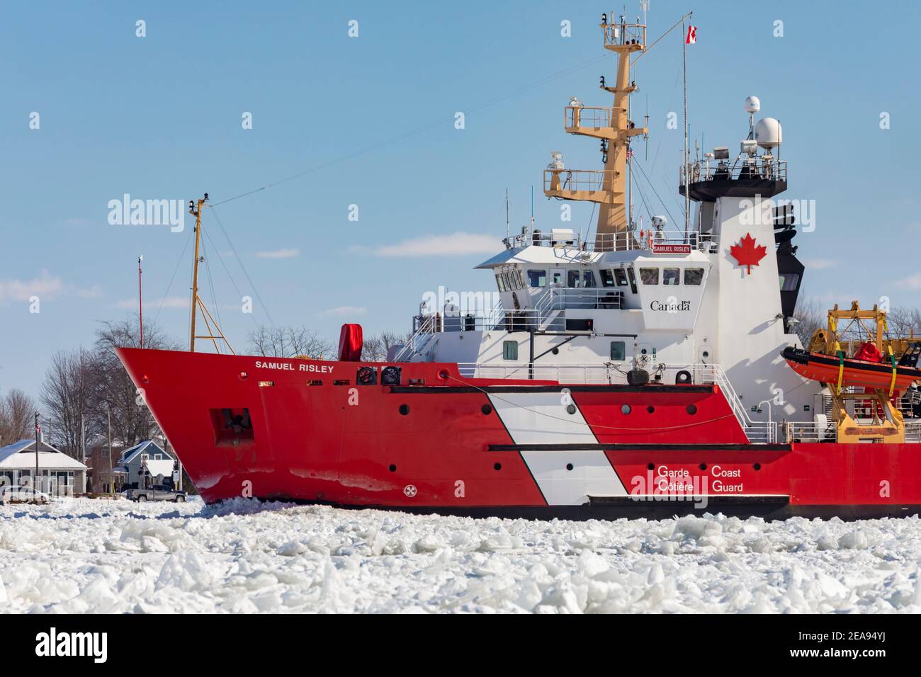 Roberts Landing, Michigan, USA. 7th Feb, 2021. The Canadian Coast Guard icebreaker Samuel Risley breaks up ice on the St. Clair River. Bitter cold has led to ice jams on the river and flooding in shoreline communities. The St. Clair River is the border between the U.S. and Canada; it drains the upper Great Lakes towards Lake St. Clair and on to Lake Erie. Credit: Jim West/Alamy Live News Stock Photo