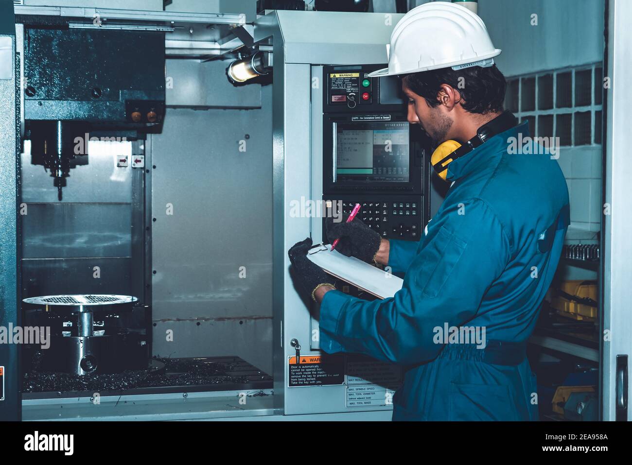 Smart factory worker or engineer do machine job in manufacturing workshop . Industry and engineering concept . Stock Photo