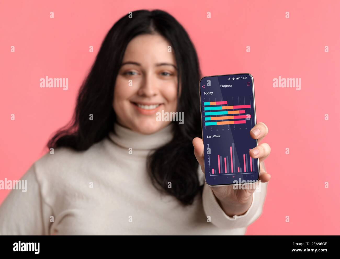 Weightloss Progress App. Plus Size Woman Showing Smartphone Application