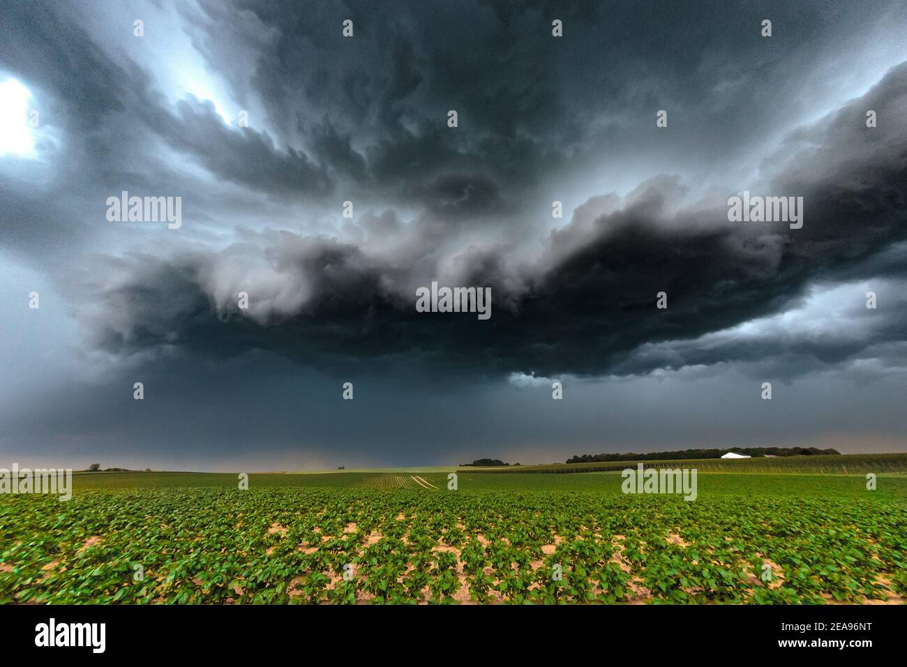 A threatening thunderstorm cell moves from Liège, Belgium across arable land Stock Photo