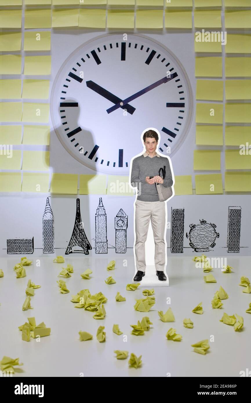 Photo collage, man with mobile phone, in front of an abstract skyline, in front of a clock, in the middle of post-its, yellow, gray, white Stock Photo