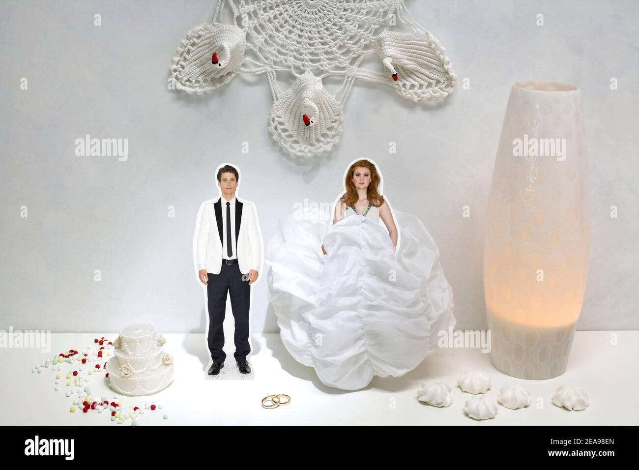 Couple, man and woman, white wedding, wedding cake, cut-out figures, lamp, rings, lucky pearls, wedding dress, wedding suit, white, luminous lamp, collage Stock Photo