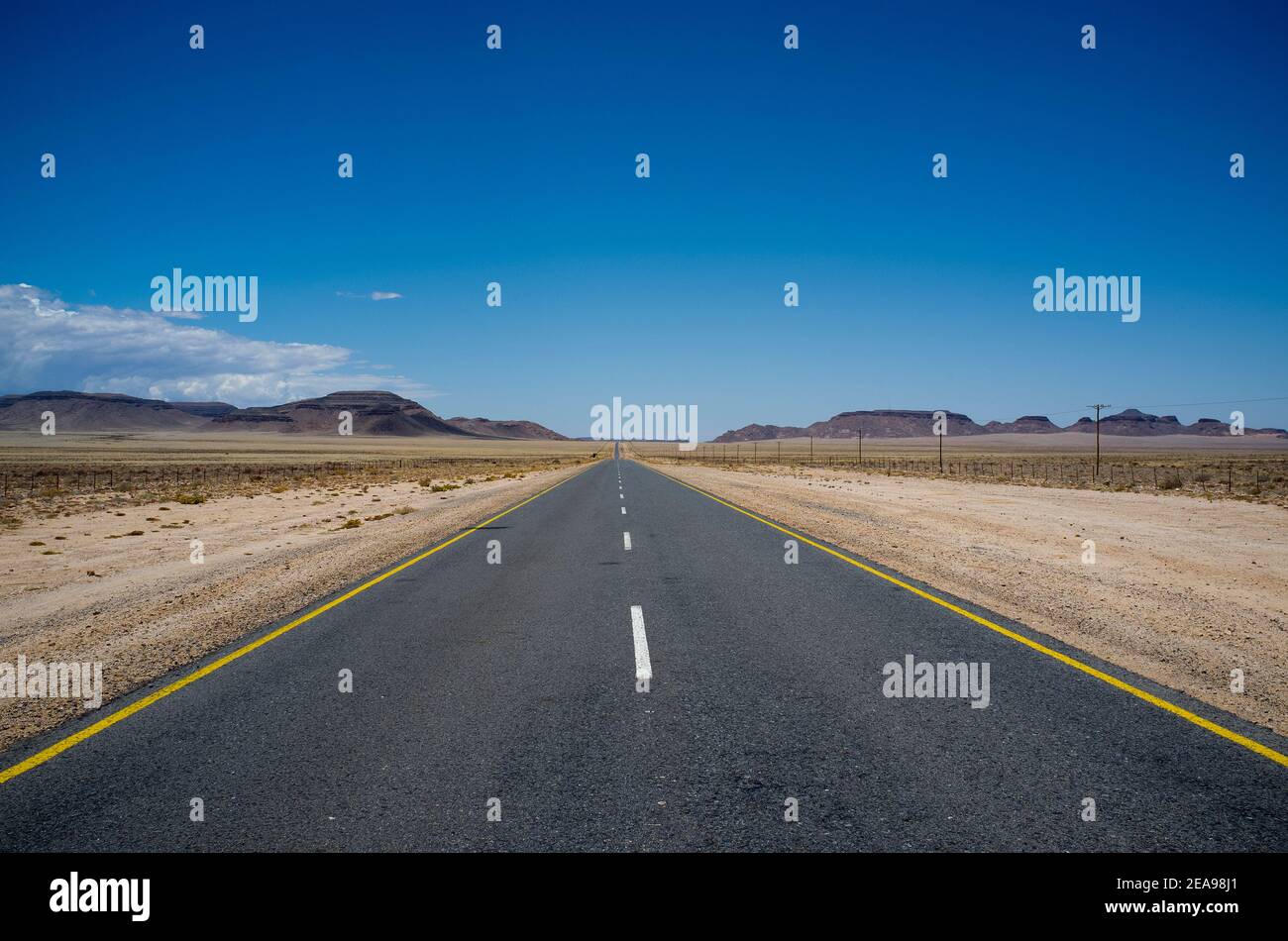 Tar road through the desert in Namibia Stock Photo
