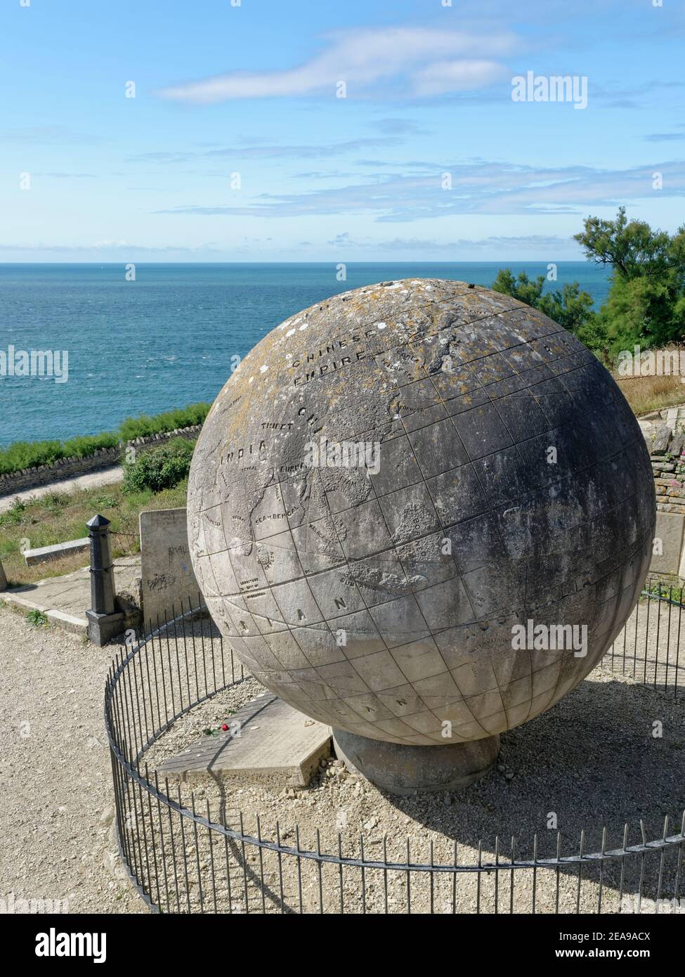 The Great Globe, a 40 ton Portland stone globe with a map of the world carved on the surface, below Durlston Castle, Durlston Head, Swanage, Dorset UK Stock Photo