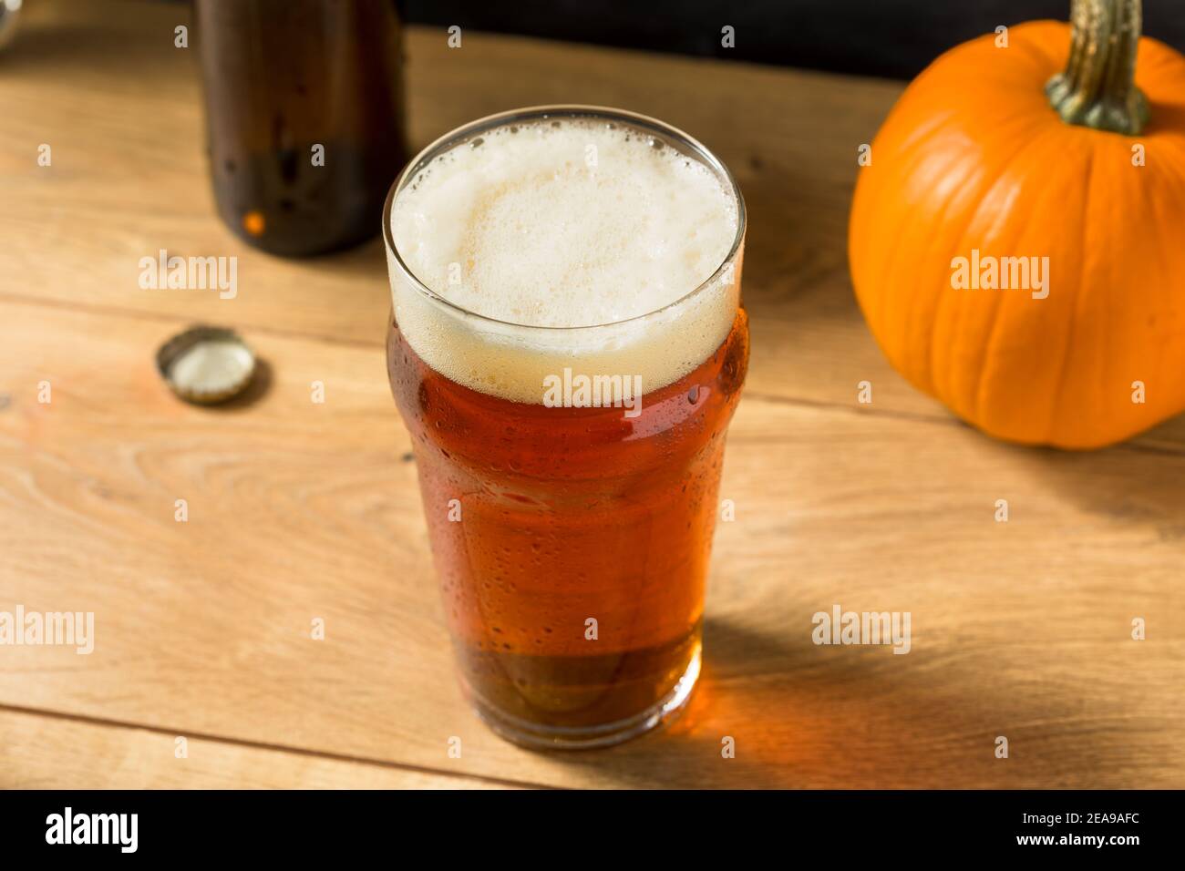 Cold Refreshing Pumpkin Ale Beer in a Pint Glass Stock Photo