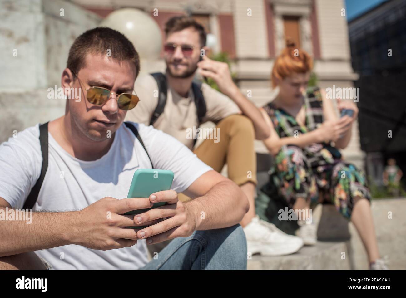 Alienation addiction. Group of friends using smartphones together ...