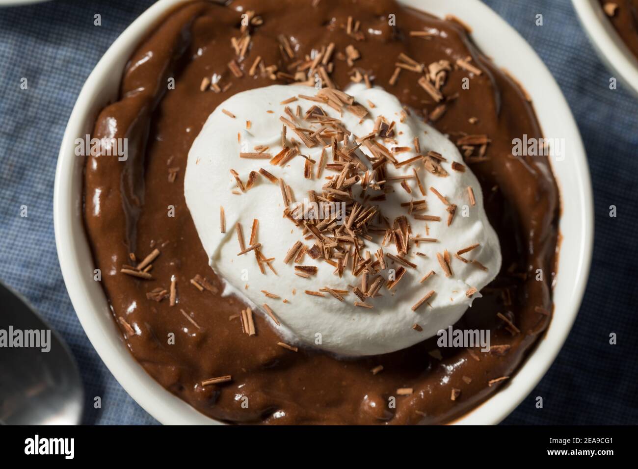 Sweet Homemade Chocolate Pudding in a Bowl with Whipped Cream Stock