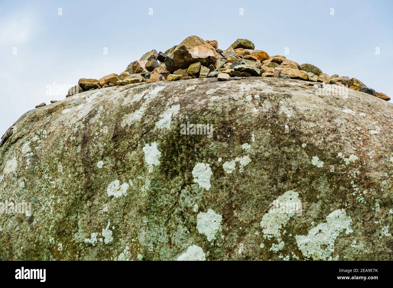 Local tradition claims that if a visitor lands three stones atop the dolmen, they will be granted a wish, or will be married within the year. Proleek Stock Photo