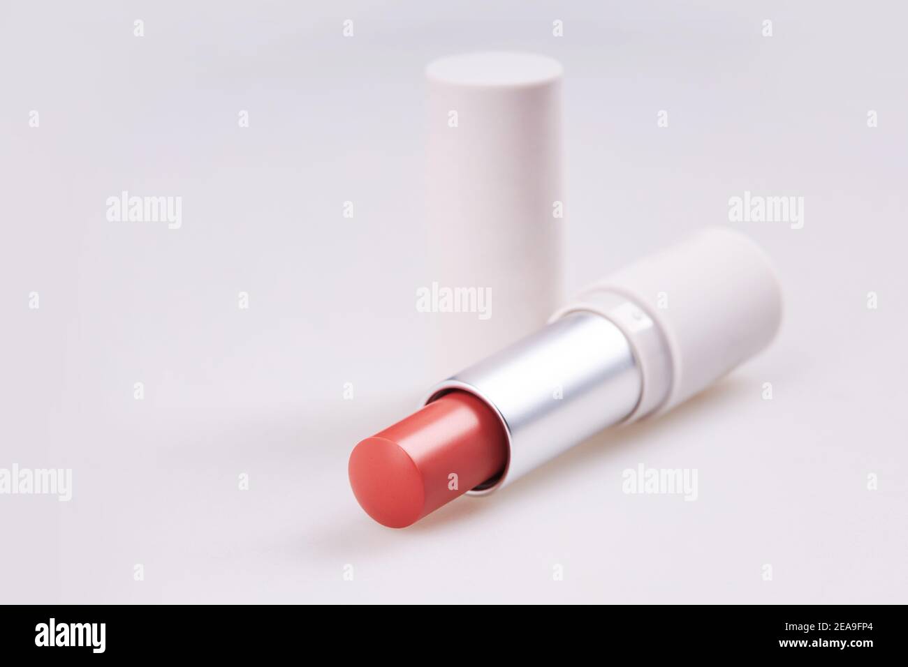Beautiful bright red lipstick in the matt container isolated on white background Stock Photo