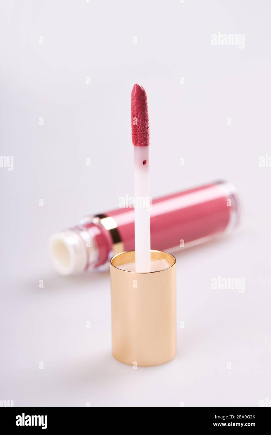 Tube of liquid lipstick gloss with applicator isolated on white background Stock Photo