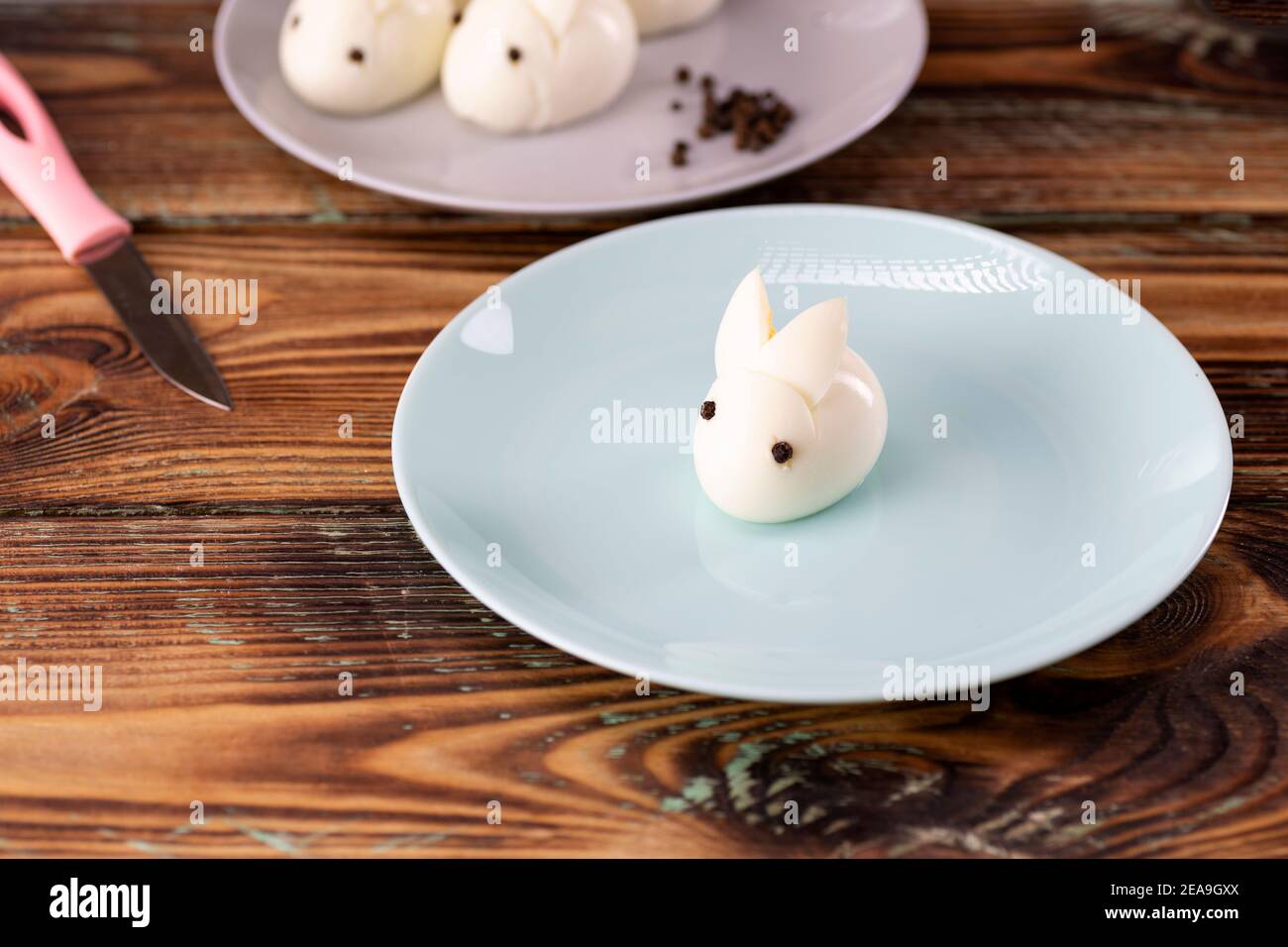 Funny bunny made of boiled eggs, Easter table decoration, Easter decor and serving. Stock Photo