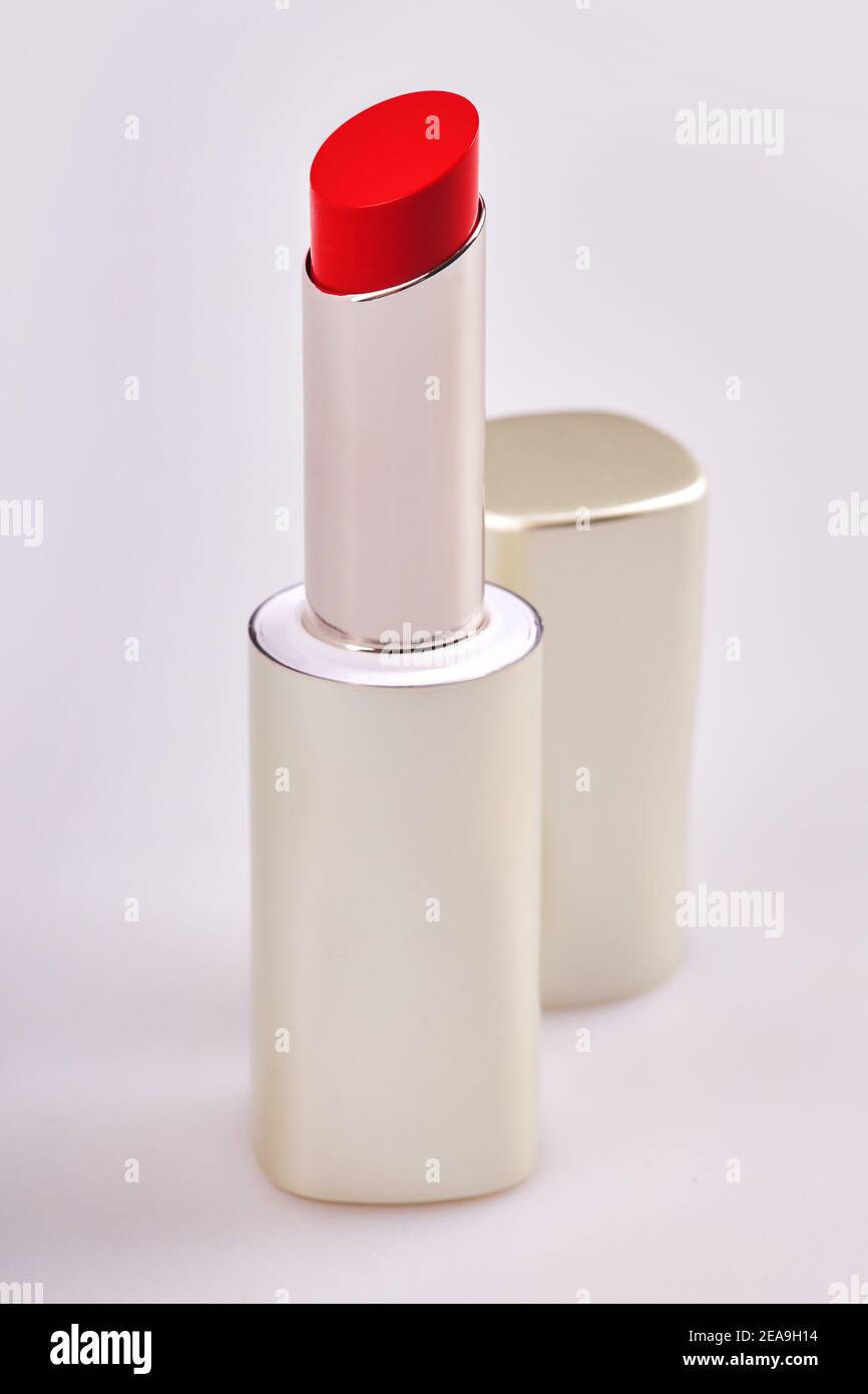Beautiful bright red lipstick in the matt container isolated on white background Stock Photo