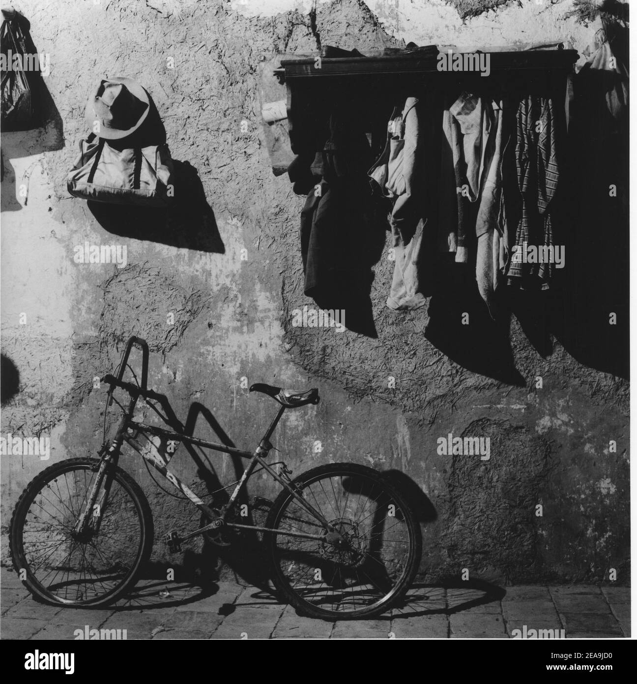 A bike leaning against a wall in Interior of a colonial house in  Falcon, Venezuela;South America. decoration home objects rust Stock Photo