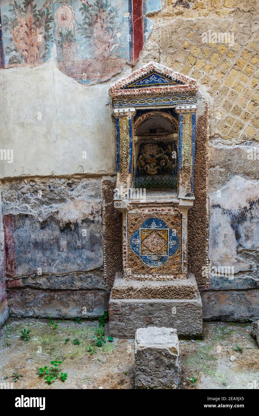 Lararium, altar or shrine of a house in the ruins of the ancient archaeological site of Herculaneum in Ercolano, Italy Stock Photo
