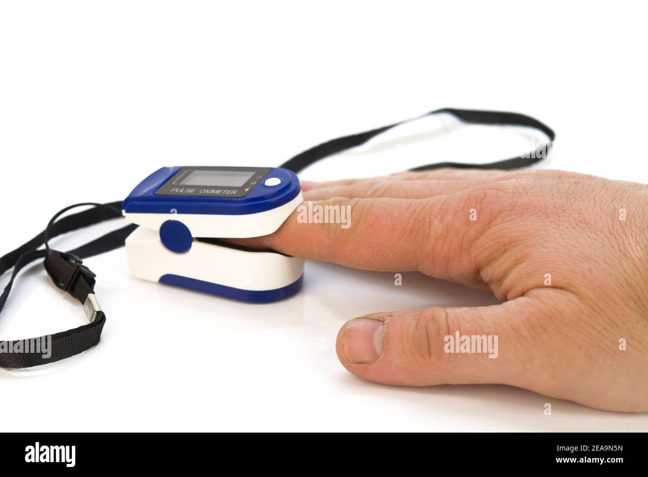 Pulse oximeter used to measure pulse rate and oxygen levels Stock Photo