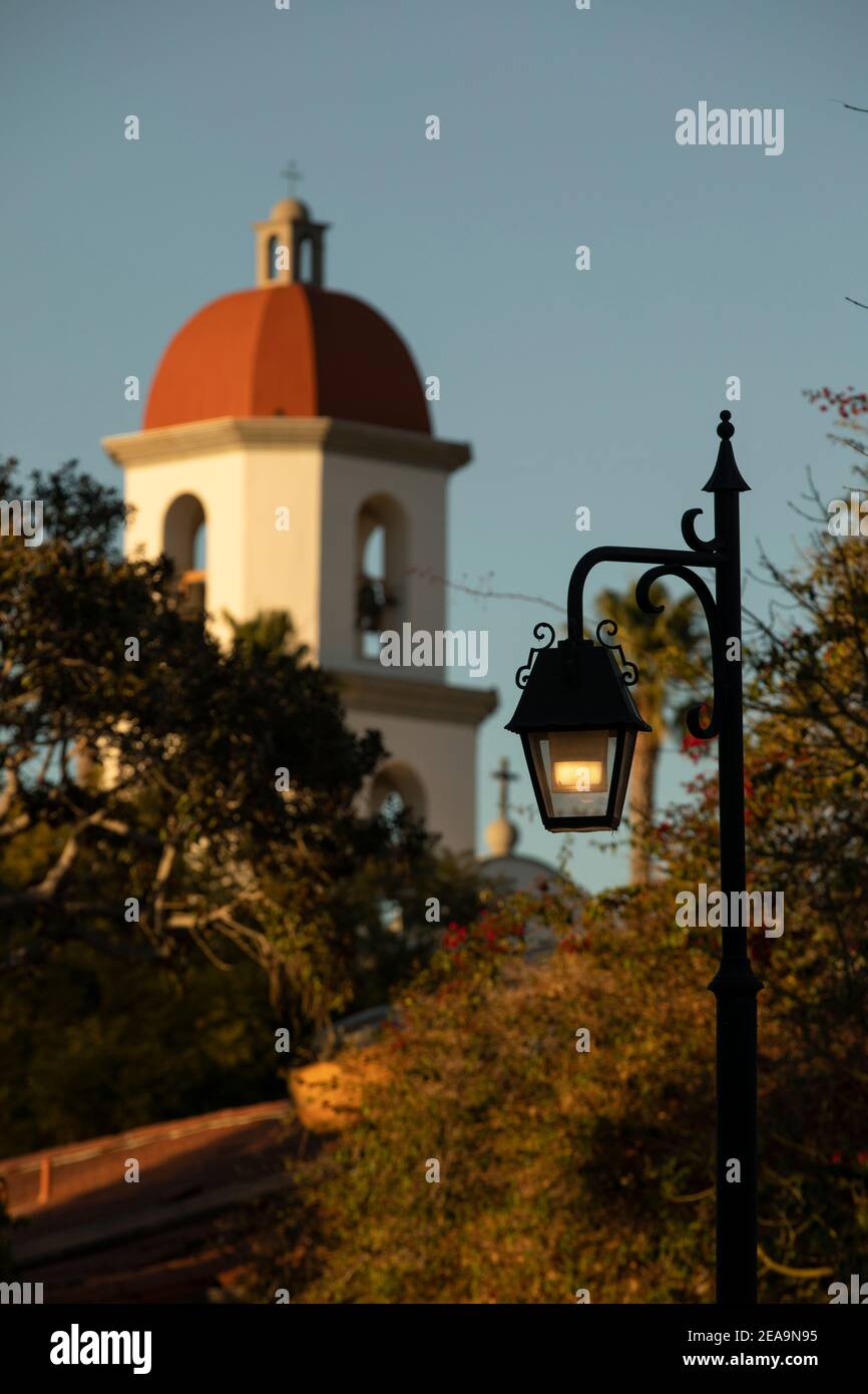 A wrought iron light post frames the historic downtown Basilica skyline