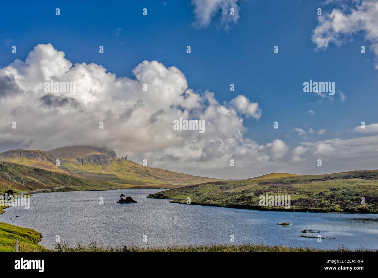 View across Loch Leathan to the Old Man of Storr on the Isle of Skye in sunshine Stock Photo