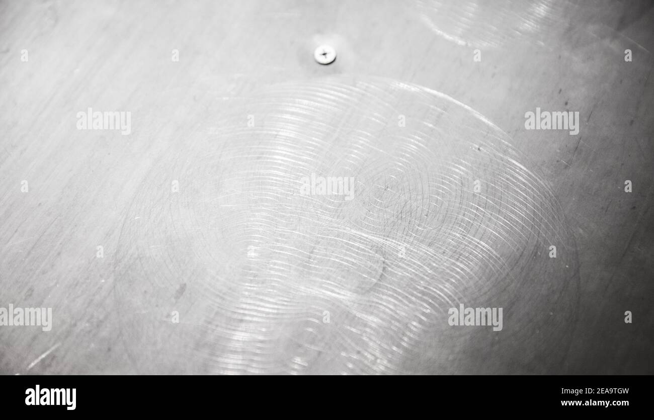 Brushed metal surface, close-up photo with selective soft focus. shiny industrial background texture Stock Photo