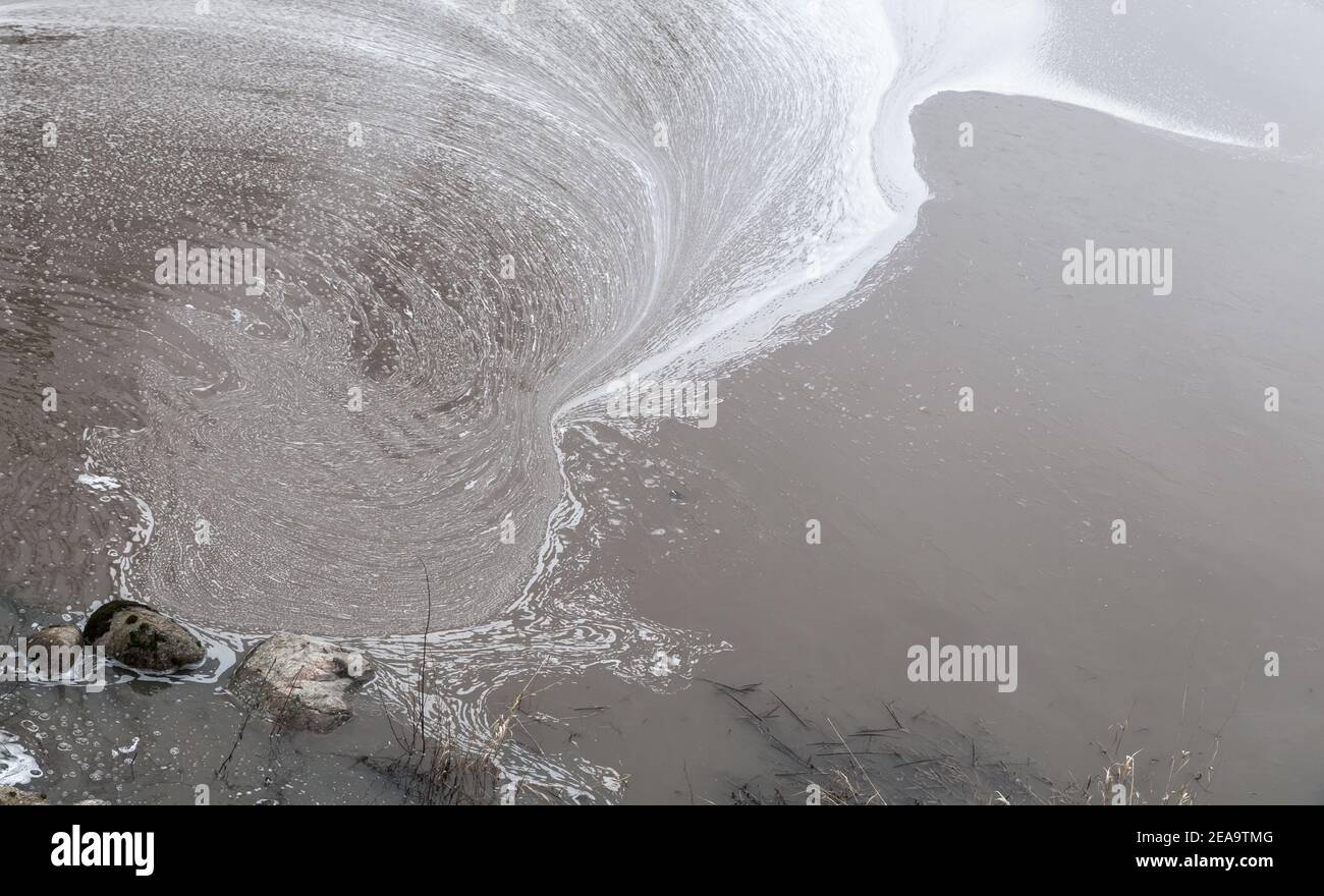 Dirty water surface with pollution foam. Ecological problem. Natural background photo texture Stock Photo