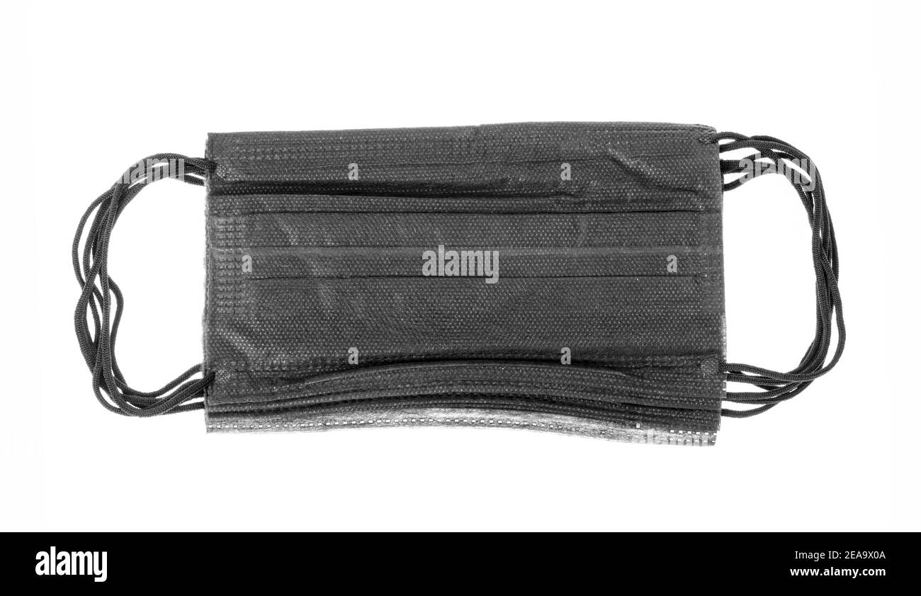 Medical disposable mask in black on white background. Studio Photo ...