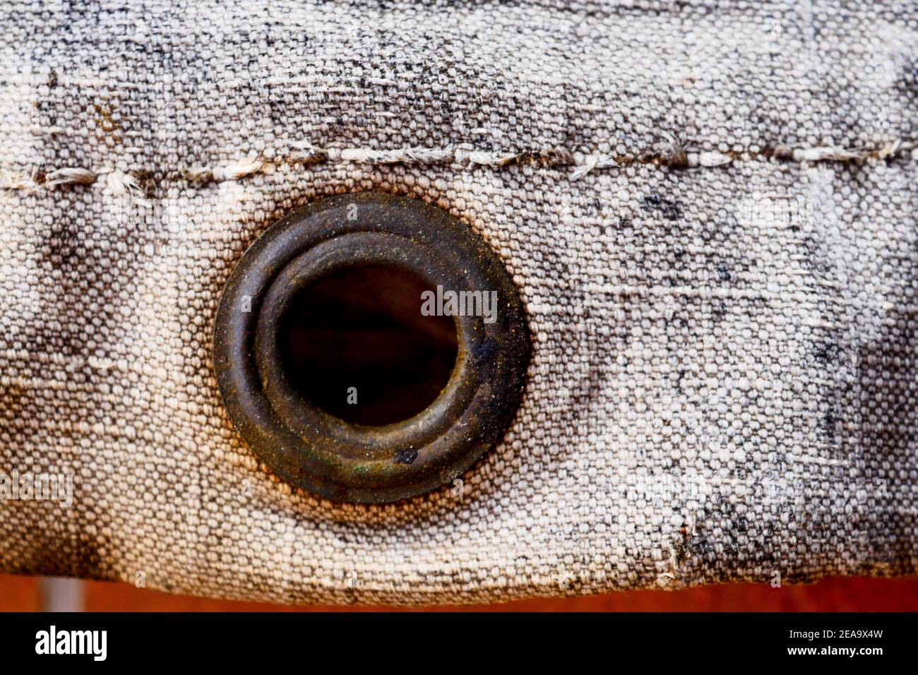 Rusted ring in an old tarpaulin, close-up view, France Stock Photo - Alamy