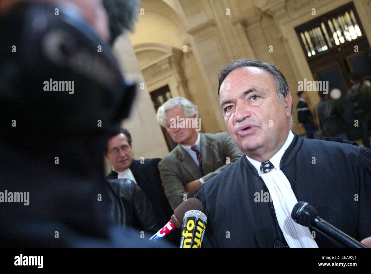 Jean-Charles Marchiani's lawyer, Maitre Jacques Tremolet de Villers, answers the press as he arrives to the magistrates' court in Paris, France, on October 3, 2005, for the opening of Marchiani's trial. Marchiani, 62, French prefect, former European Parlement member and former right-hand man of the French government for secret missions, appears for influence peddling in a 1.25 million euro contract signed in the 90's between the French weapon company Giat Industries and the German company Renk. He incurs a ten-year prison sentence and a 150,000 euro fine. Photo by Mehdi Taamallah/ABACAPRESS.CO Stock Photo