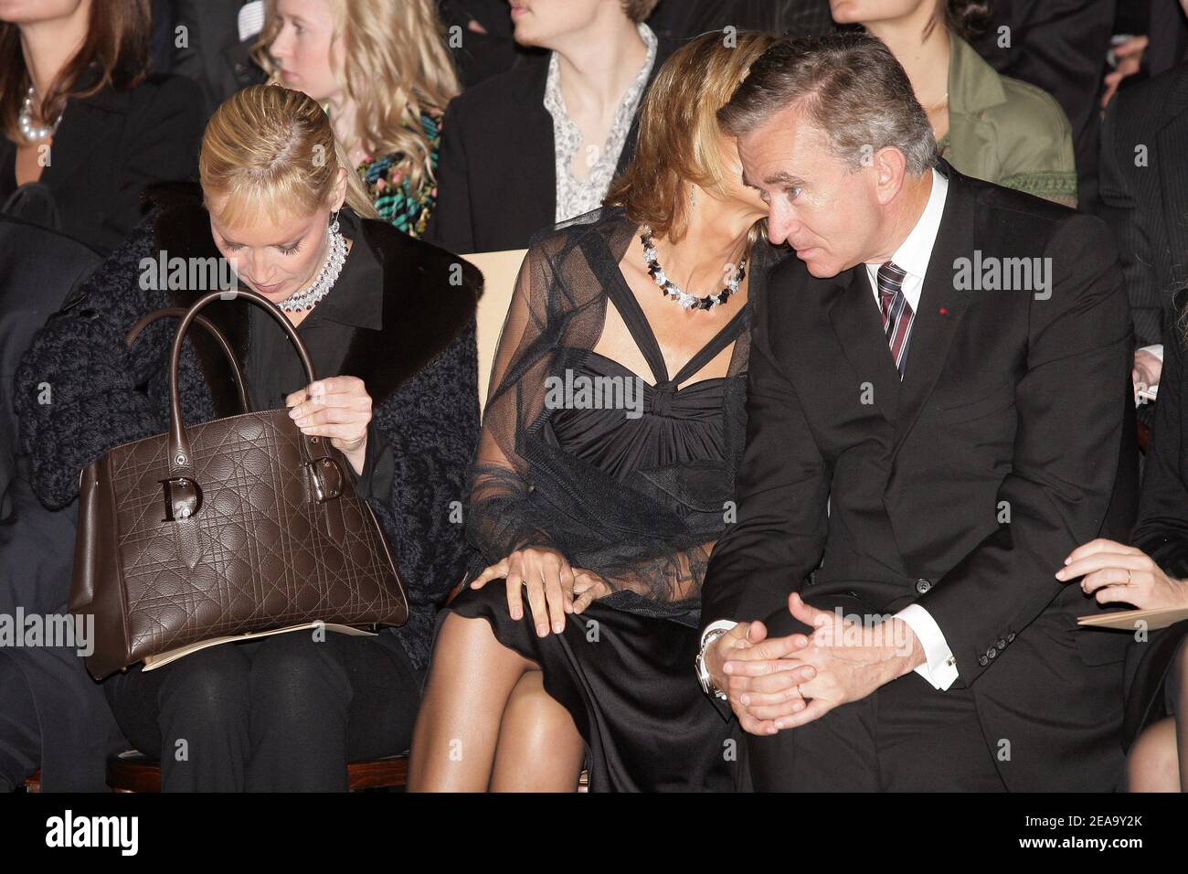 U.S. actress Sharon Stone poses surrounded by LVMH CEO Bernard Arnault (L)  and French Minister of Culture Renaud Donnedieu de Vabres upon arrival to  the cocktail reception for the inauguration of the