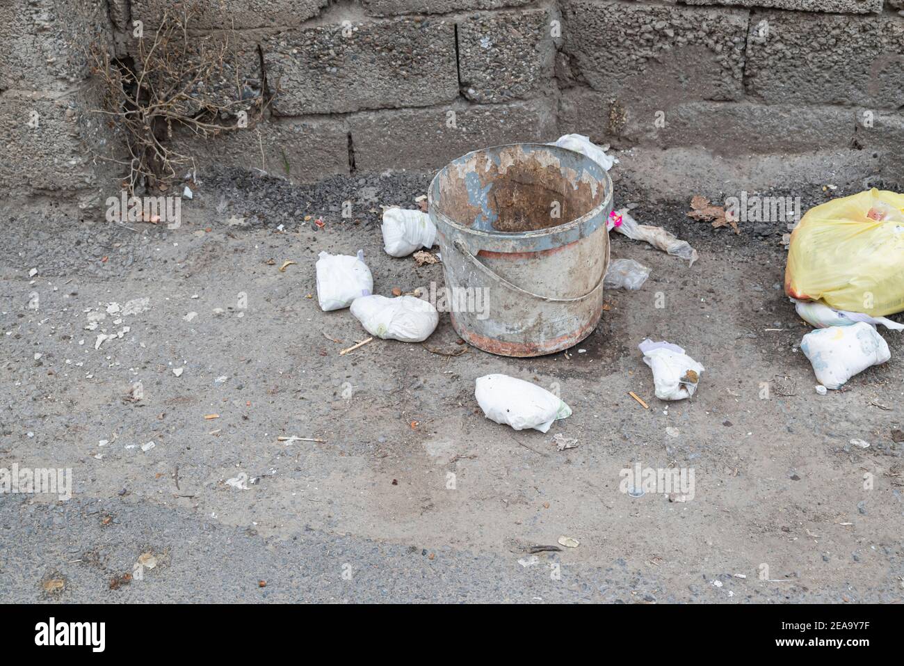 Garbage dumped around the trash can Environmental cleaning concept