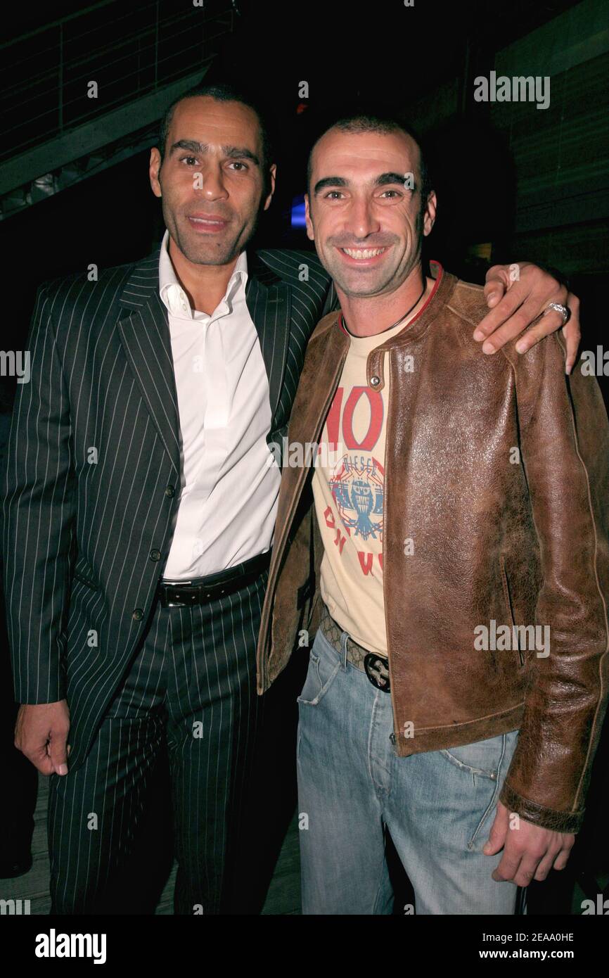 Sports TV presenter Richard Dacoury poses with French soccer player Jerome Alonzo during the opening party of the new Radisson SAS Hotel of Boulogne-Billancourt near Paris, France, on october 06, 2005. Photo by Benoit Pinguet/ABACAPRESS.COM Stock Photo