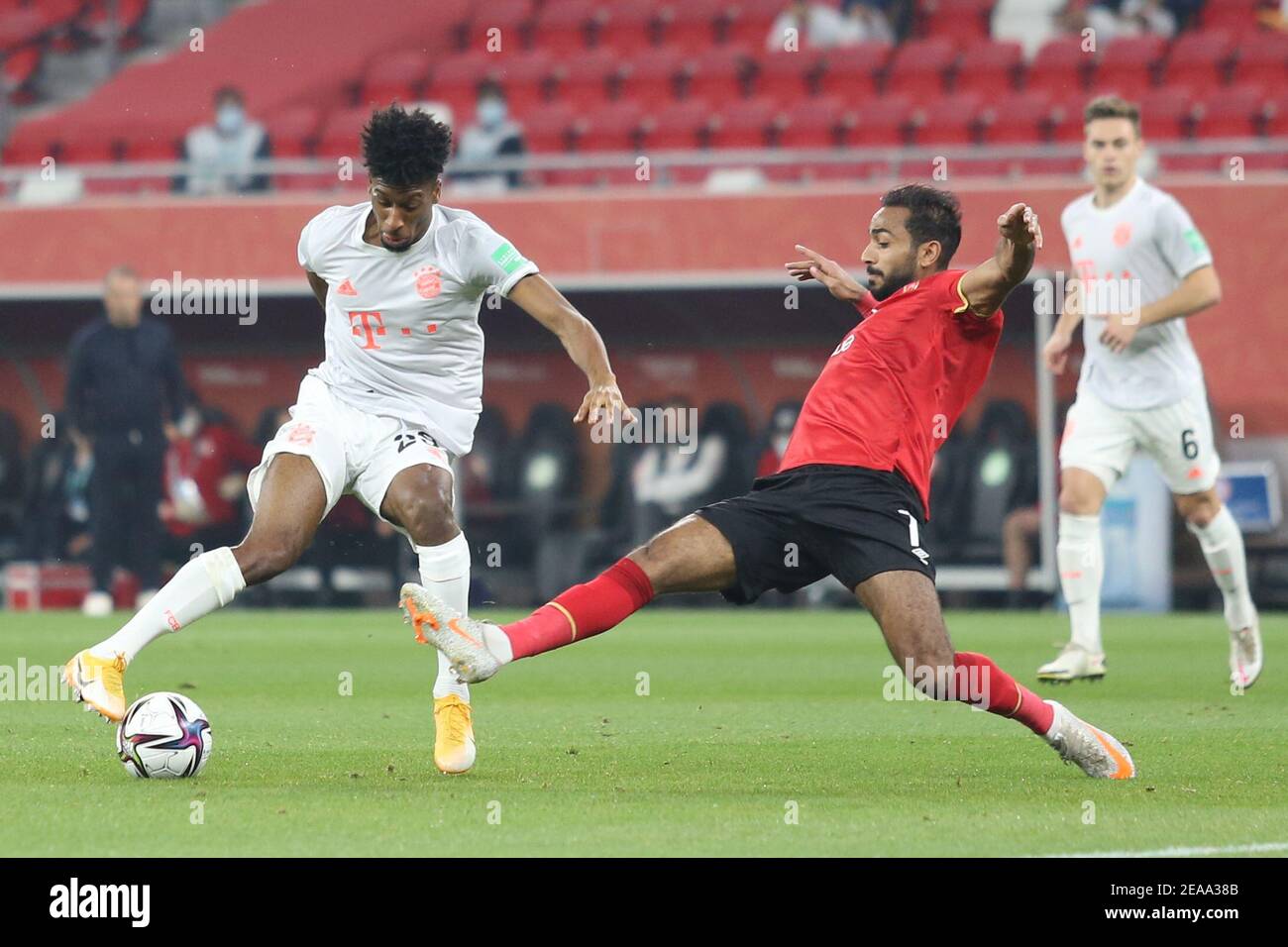 DOHA, QATAR - FEBRUARY 08: Kahraba of Al Ahly SC and Kingsley Coman of FC Bayern Muenchen during the semi-final match between Al Ahly SC and FC Bayern Muenchen at Ahmad Bin Ali Stadium on February 8, 2021 in Doha, Qatar. (Photo by Colin McPhedran/MB Media) Stock Photo