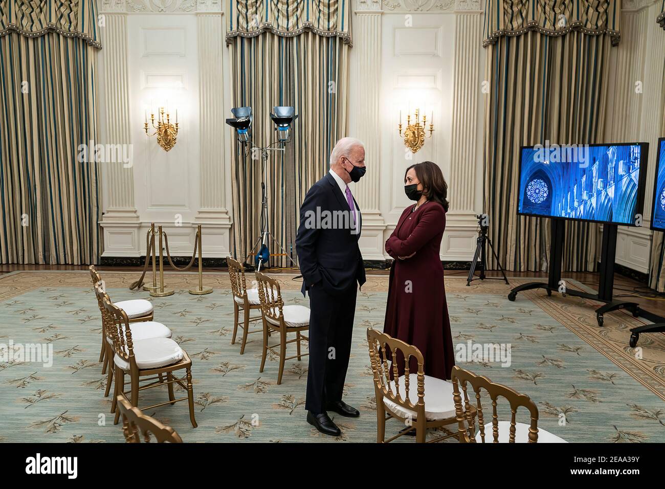 President Joe Biden talks with Vice President Kamala Harris in the