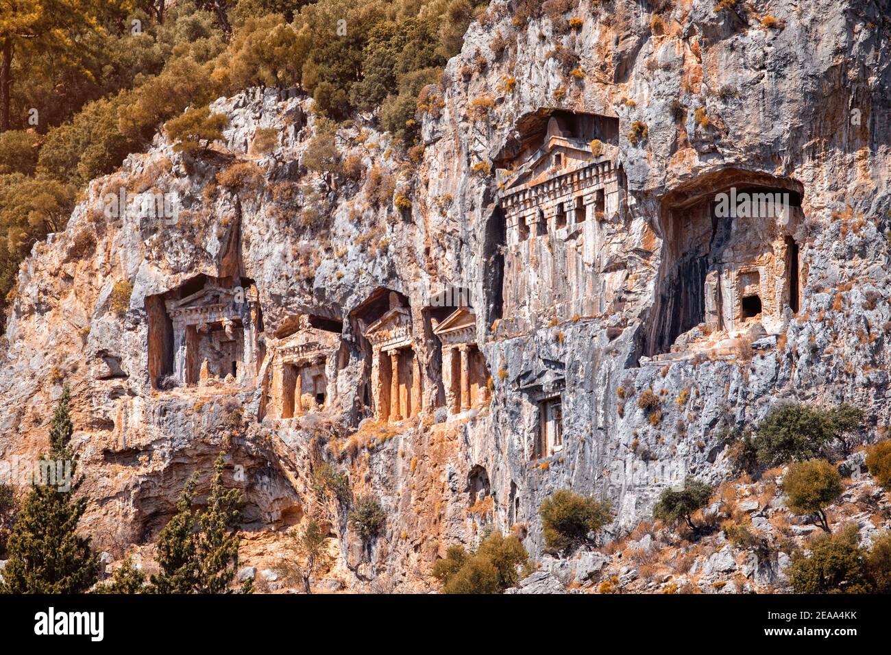 Famous historical and cultural monument - tombs of kings of ancient town Kaunos in modern city of Dalyan, Turkey. Architecture carved in rocks and cli Stock Photo