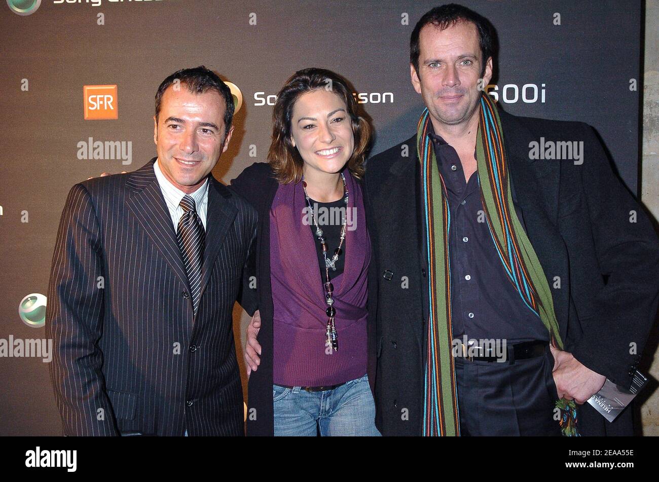 (L-R) French TV presenter Bernard Montiel, actress Shirley Bousquet and actor Christian Vadim attend the opening of Danish top model Helena Christensen's photo exhibition, 'An Eye for Beauty', held at the Galerie Diana Marquardt in Paris, France, on October 21, 2005. The pictures have been taken with a Sony Ericsson K750i mobile phone. Photo by Bruno Klein/ABACAPRESS.COM. Stock Photo