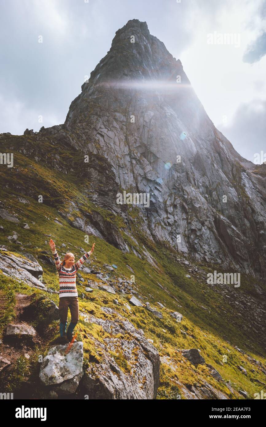 Woman enjoying mountain peak landscape travel hiking alone in Norway outdoor adventure active healthy lifestyle weekend leisure trip Stock Photo