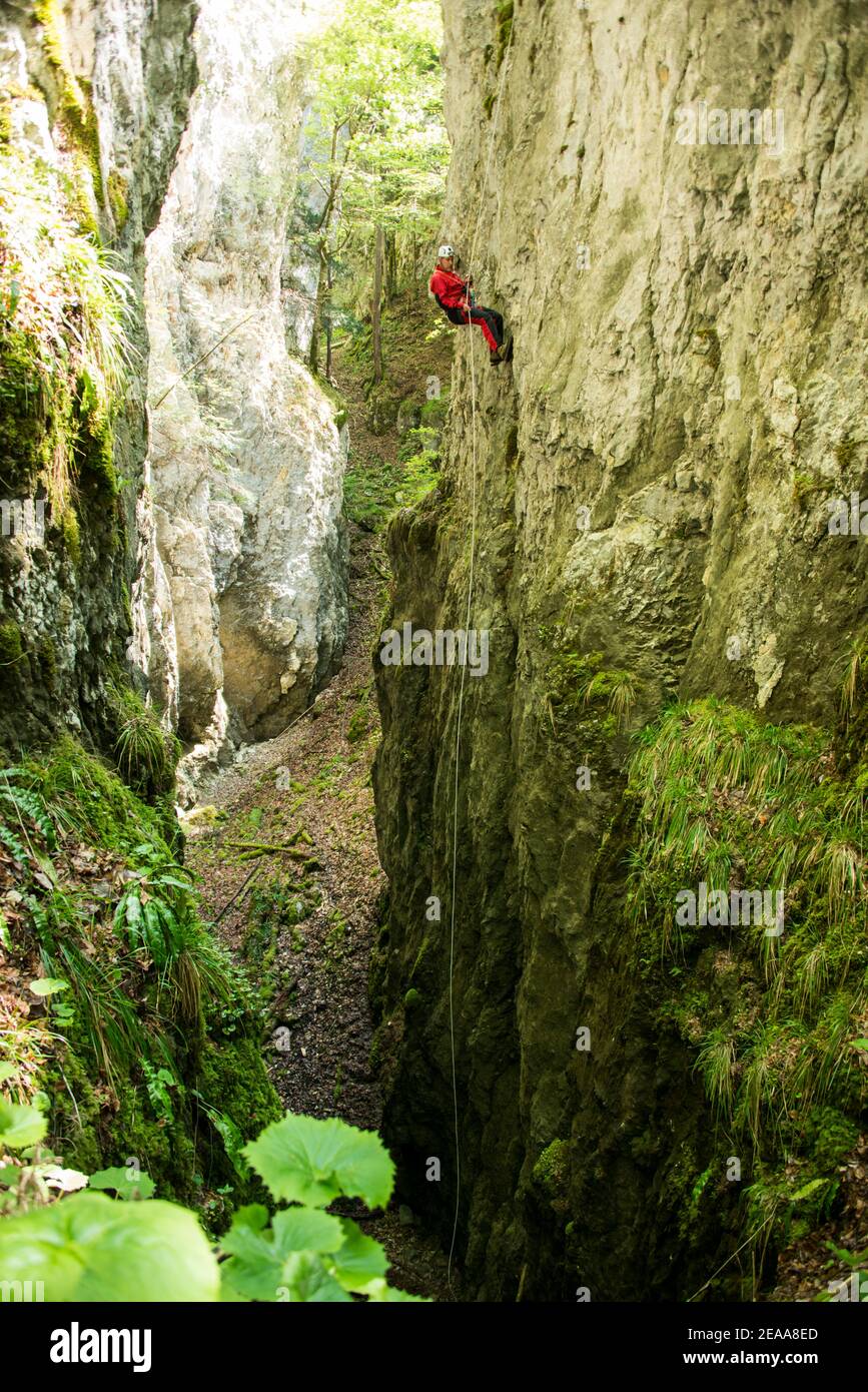 abseil down into a deep gorge Stock Photo